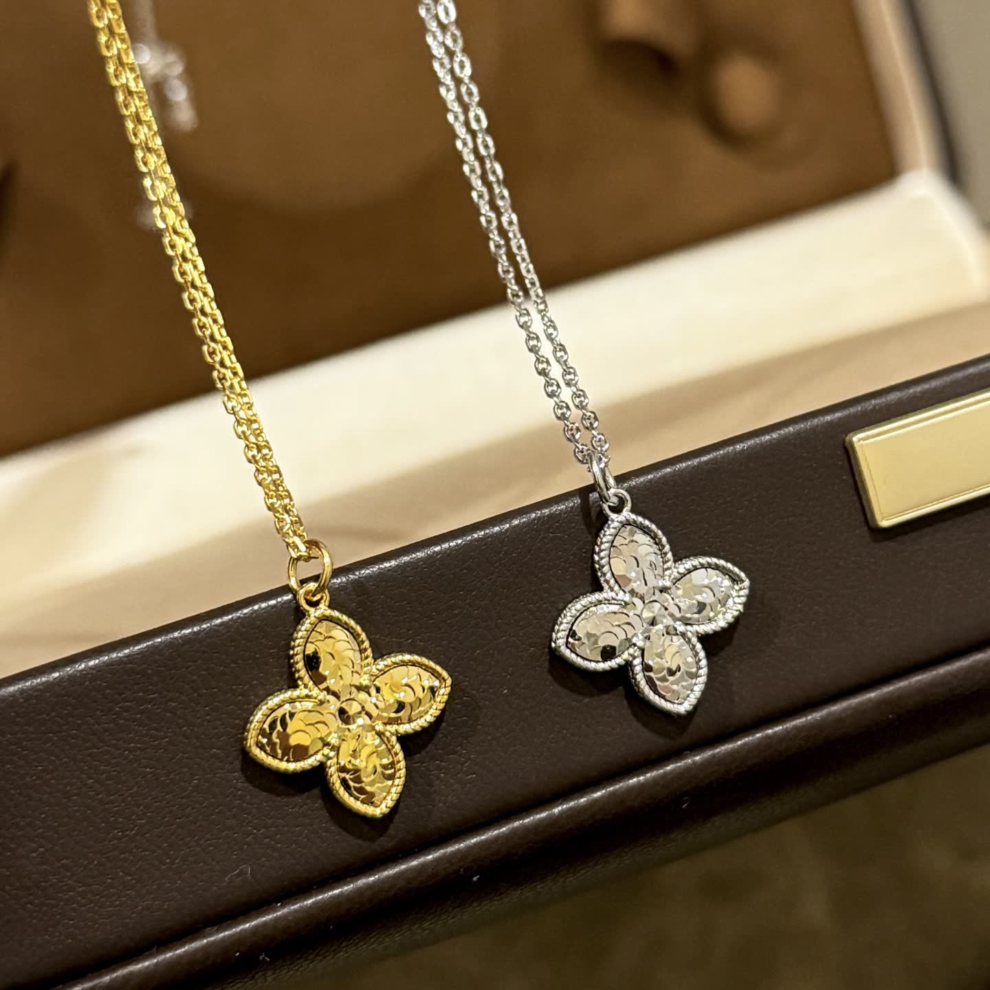 Van Cleef & Arpels Gold and Silver Flower Pendant Necklaces